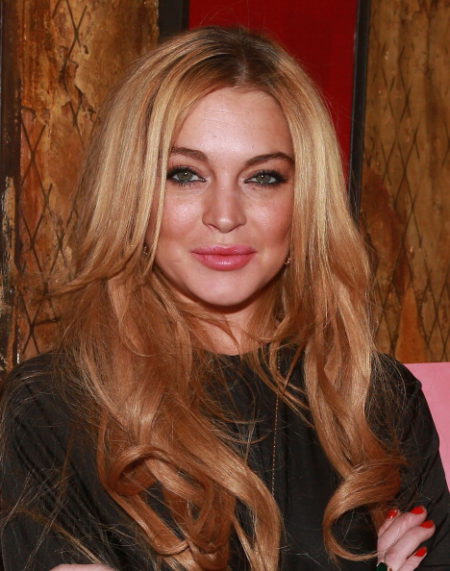 NEW YORK,  NY - DECEMBER 16: Lindsay Lohan attends the "Just Sing It" app launch event at Pravda on December 16,  2013 in New York City. (Photo by Robin Marchant/Getty Images)