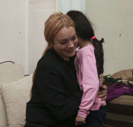 ISTANBUL,  TURKEY - SEPTEMBER 26: Hollywood actress Lindsay Lohan (L) hugs with a Syrian refugee girl at her house after the visit to a hospital built for Syrian refugees at Sultanbeyli suburb of Istanbul,  Turkey on September 26,  2016. (Photo by Stringer/Anadolu Agency/Getty Images)