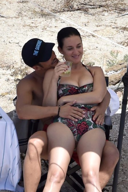 *PREMIUM-EXCLUSIVE* ** RESTRICTIONS: ONLY UNITED STATES,  BRAZIL,  CANADA ** Sardinia,  ITALY - *PREMIUM EXCLUSIVE* **MUST CALL FOR PRICING** Sardinia,  Italy - Katy Perry and beau Orlando Bloom have a fun little beach day while vacationing in Italy. The two are joined by Katy's pregnant sister Angela and her brother David. Katy and Orlando seem to partake in vaping by the shore. The hot couple pack on the PDA in the sea hugging and kissing each other. Katy is wearing a cute high waisted ruffle swimsuit donned with a floral print. The two are all smiles and seem to be really in love. **SHOT ON 8/3/16** AKM-GSI August 6,  2016 To License These Photos,  Please Contact: Maria Buda (917) 242-1505 mbuda@akmgsi.com sales@akmgsi.com or Mark Satter (317) 691-9592 msatter@akmgsi.com sales@akmgsi.com www.akmgsi.com AKM-GSI 6 AUGUST 2016 To License These Photos,  Please Contact : Maria Buda (917) 242-1505 mbuda@akmgsi.com or Mark Satter (317) 691-9592 msatter@akmgsi.com sales@akmgsi.com