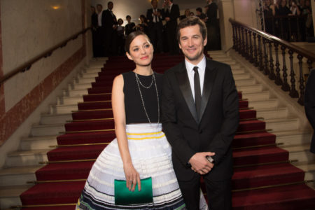 (L-R) Marion Cotillard and Guillaume Canet arrive at the 40th Cesar Film Awards 2015 Cocktail at Theatre du Chatelet on February 20,  2015 in Paris,  France. (Photo by Stephane Cardinale/Corbis via Getty Images)
