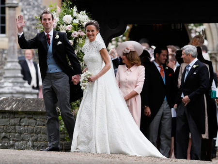 Pippa Middleton and James Matthews smile for the cameras after their wedding at St Mark's Church in Englefield,  England Saturday,  May 20,  2017. Middleton,  the sister of Kate,  Duchess of Cambridge married hedge fund manager James Matthews in a ceremony Saturday where her niece and nephew Prince George and Princess Charlotte was in the wedding party,  along with sister Kate and princes Harry and William. (AP Photo/Kirsty Wigglesworth,  Pool)